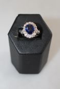 Fine sapphire and diamond cluster ring set in 18 carat white gold,
