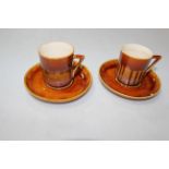Two Linthorpe Pottery Chr. Dresser cups and saucers, shape no. 640.
