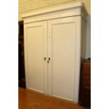 Victorian painted pine wardrobe having two panelled doors above a long drawer,