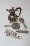 Embossed silver brushes and mirror, silver spoons, EP jug, etc.