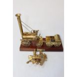 Brass model of Stephenson's Rocket, 30cm long, and small model of Titanic sextant (2).