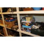 Full shelf of games and books including Star Wars, guitar, marbles, etc.