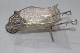 Silver wheelbarrow novelty bon bon basket, having pierced and engraved decoration, Birmingham c1910,