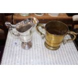 19th Century silver plated helmet jug, 20cm, together with antique two handled brass cup (2).