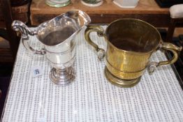 19th Century silver plated helmet jug, 20cm, together with antique two handled brass cup (2).