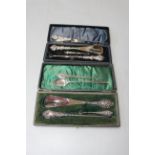 Collection of silver handled button hooks and shoe horns, trowel book mark and spoon (two cases).