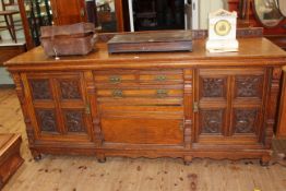 Victorian Pollard oak sideboard having three central drawers above a cupboard door flanked by two