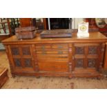 Victorian Pollard oak sideboard having three central drawers above a cupboard door flanked by two