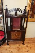 Neat Art Nouveau side cabinet having glazed door above a fall front music/magazine compartment,