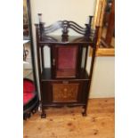 Neat Art Nouveau side cabinet having glazed door above a fall front music/magazine compartment,