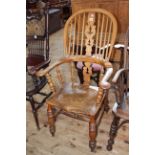 Antique Windsor pierced splat back elbow chair.