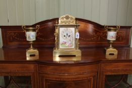 Continental porcelain and brass three piece garniture clock set.