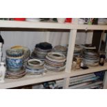 Full shelf of collectors and other plates, vases, steins, two jardinieres and stands, stick stand,