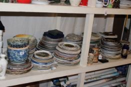 Full shelf of collectors and other plates, vases, steins, two jardinieres and stands, stick stand,