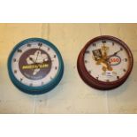 Two reproduction advert wall clocks.