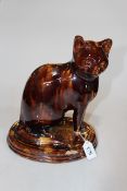 19th Century 'Canny Hill' cat, open leg with oval moulded base, 29cm.