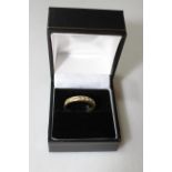 18 carat gold and diamond eight stone half eternity ring, size O/P.