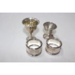 Pair silver napkin rings, Birmingham 1912, and two silver egg cups (4).