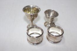 Pair silver napkin rings, Birmingham 1912, and two silver egg cups (4).