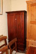 Hardwood combination wardrobe having two panelled doors above three drawers, 180cm by 92cm by 92cm.