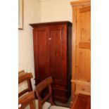 Hardwood combination wardrobe having two panelled doors above three drawers, 180cm by 92cm by 92cm.