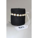 18 carat gold pearl and bead bracelet.