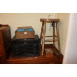 Elm stool, three drawer table cabinet, two boxes of printing type,