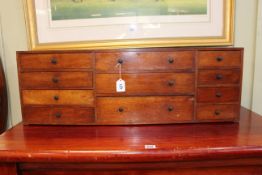 Victorian mahogany nest of eleven drawers, 29cm by 86cm by 20cm.