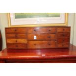 Victorian mahogany nest of eleven drawers, 29cm by 86cm by 20cm.