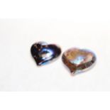 Two John Ditchfield heart shaped paperweights.