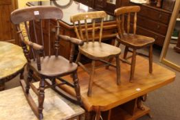 Three elm seated child's chairs including one rocker.