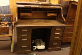 Early 20th Century Lebus oak double pedestal roll top desk, 124cm by 120cm by 69cm.