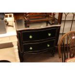 Black lacquered and silvered serpentine front two drawer chest, 82cm by 80cm by 50cm.