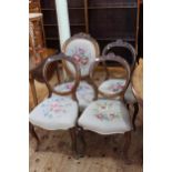 Set of three Victorian walnut balloon back parlour chairs and similar nursing chair.