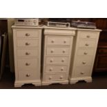 Pair slim white five drawer chests and slim white six drawer chest (3).