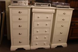 Pair slim white five drawer chests and slim white six drawer chest (3).