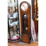 1930's oak dome topped triple weight longcase clock having silvered dial, 186cm by 42cm.