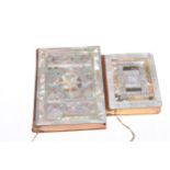Two ornate mother of pearl veneered New Testament books, largest 16cm by 11cm.