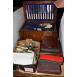 Oak lidded canteen box with two drawers and collection of assorted cutlery.