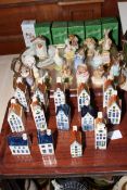 Fourteen Royal Albert Beatrix Potter characters and fourteen Bols houses.