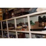 Full shelf of collectables including slate mantel clock, copper and brass coal scuttles, metalwares,