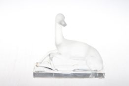 Lalique greyhound, etched mark to base, 21cm wide, 19.5cm high.