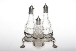 George III silver Warwick three bottle cruet on shell feet, makers mark R.P (R.