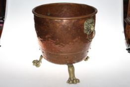 Brass and copper two handled coal bucket on paw feet.