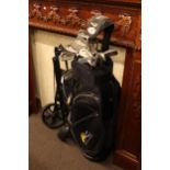 Golf bag, caddy and set of twelve golf clubs including Callaway Big Bertha.