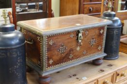 Small Eastern hardwood, brass and studded trunk on bun feet, 38cm by 65cm by 34cm.