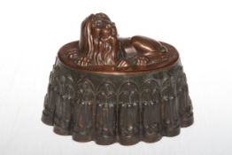 Victorian copper and tin jelly mould with recumbent lion, stamped 114, 20cm across.