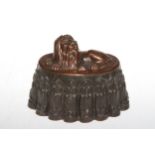 Victorian copper and tin jelly mould with recumbent lion, stamped 114, 20cm across.