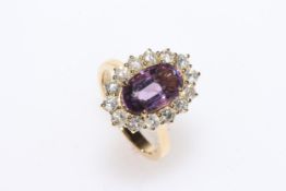 Amethyst and diamond 18 carat gold cluster ring, with 3 carat amethyst, size N.