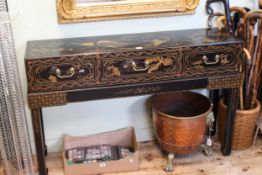 Oriental black lacquered and landscape decorated three drawer console table on stand,